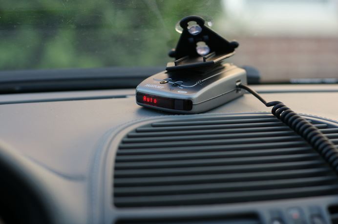 car radar detector on dashboard